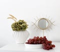 Fall table arrangement. Red grapes, dried hydrangea flower.