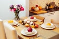 Fall table setting for celebration Thanksgiving day family party. Autumn composition with candles, fruits, nuts and Royalty Free Stock Photo