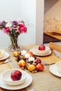 Fall table setting for celebration Thanksgiving day family party. Autumn composition with candles, fruits, nuts and Royalty Free Stock Photo