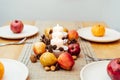 Fall table setting for celebration Thanksgiving day family party. Autumn composition with candles, fruits, nuts and Royalty Free Stock Photo