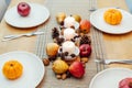 Fall table setting for celebration Thanksgiving day family party. Autumn composition with candles, fruits, nuts and Royalty Free Stock Photo