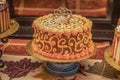 fall-themed-decorated-cakes-displayed-sale-autumn-leaf-runner-oranges-golds-130911718.jpg