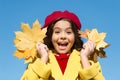 Fall time fashion. paris child wear beret. beauty of nature. french kid in autumn. cheerful girl with yellow maple