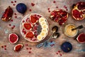 Fall and winter breakfast set. Acai superfoods smoothies bowl with chia seeds, pomegranate, banana, fresh figs, hazelnut butter. Royalty Free Stock Photo