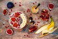 Fall and winter breakfast set. Acai superfoods smoothies bowl with chia seeds, pomegranate, banana, fresh figs, hazelnut butter. Royalty Free Stock Photo