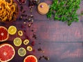 Fall and winter ingredients still life with grapefruits, lemon,cydonia, cranberries, herbs, dried apples, cinnamon sticks, spices Royalty Free Stock Photo