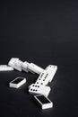 Fallen dominoes domino effect lose fail concept black background Royalty Free Stock Photo