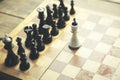 Fallen king pieces surrounded by the other color chess pieces Royalty Free Stock Photo