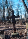 Fallen metal cross on an abandoned grave