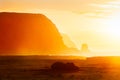 Fallen moai in golden haze in Easter Island