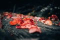 Fallen red tree leaves lying on a bench Royalty Free Stock Photo