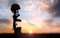 Fallen Soldier background with military helmet boots and rifle