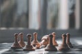 Fallen white king surrounded by white pawns on a chessboard Royalty Free Stock Photo