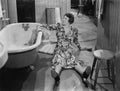 Fallen woman on floor next to bathtub Royalty Free Stock Photo