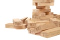 Fallen wooden blocks from the Jenga Tower game on a white background close-up. Home entertainment Royalty Free Stock Photo