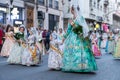 Fallera Commission parading down Calle de la Paz, seen from front, during the Fallas offering. Valencia, Spain - March Royalty Free Stock Photo