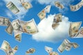 Falling American dollars and sky on background. Money rain Royalty Free Stock Photo