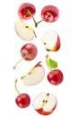 Falling apple and cherries isolated on white background Royalty Free Stock Photo