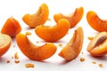 Falling apricot slices isolated on white background, flat lay. with clipping path. full depth of field. focus stacking.