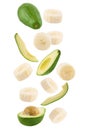 Falling banana and avocado isolated on white background