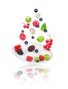 Falling berries on saucer Royalty Free Stock Photo