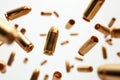 Falling bullets border over white background with light Royalty Free Stock Photo