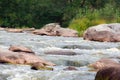 Falling blurred water among the stones Royalty Free Stock Photo