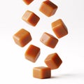 Falling caramel cubes, isolated on a white Royalty Free Stock Photo