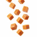 Falling caramel cubes, isolated on a white Royalty Free Stock Photo