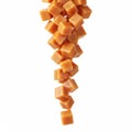 Falling caramel cubes, isolated on a white Royalty Free Stock Photo