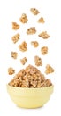 Falling cereal crisps close-up isolated on white. Royalty Free Stock Photo