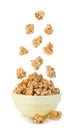 Falling cereal crisps close-up isolated on white. Royalty Free Stock Photo