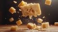 Falling Cheese Cubes on Wooden Surface Royalty Free Stock Photo