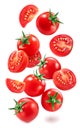 Falling cherry tomatoes and tomato slices isolated on white background. Macro shot. File contains clipping paths for each item Royalty Free Stock Photo