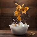 Falling corn flakes with milk splash on wood