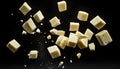 Falling cubes of white cheese isolated on black background Royalty Free Stock Photo