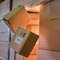 Falling and damage to packaging and goods in parcels in the warehouse. Problems with the safety of cargo during postal delivery Royalty Free Stock Photo