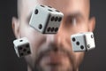 Falling dice. Motion blurred man in background Royalty Free Stock Photo