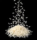 Falling dry rice grains isolated on black background Royalty Free Stock Photo