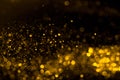 Falling flow of golden glitter dust shiny sparkle bokeh Royalty Free Stock Photo