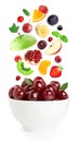 Falling fresh fruits and berries in bowl Royalty Free Stock Photo