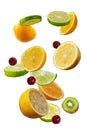 Falling fresh mixed citruses. Slices of the lemon, kiwi, cherry,and lime the air Royalty Free Stock Photo