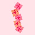 Falling gift boxes. Pink boxes with ribbons and bows
