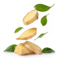Falling ginger slice with green leaf Royalty Free Stock Photo