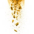Falling gold nuggets and gold dust on white background Royalty Free Stock Photo