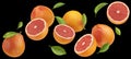 Falling grapefruits isolated on black background Royalty Free Stock Photo