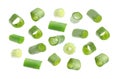 Falling green onions slices on background