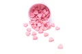 Falling heart candy in Pink polka dot paper cups isolated