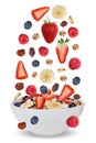 Falling ingredients of fruit muesli for breakfast in bowl with f Royalty Free Stock Photo