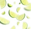 Falling juicy cut limes on background